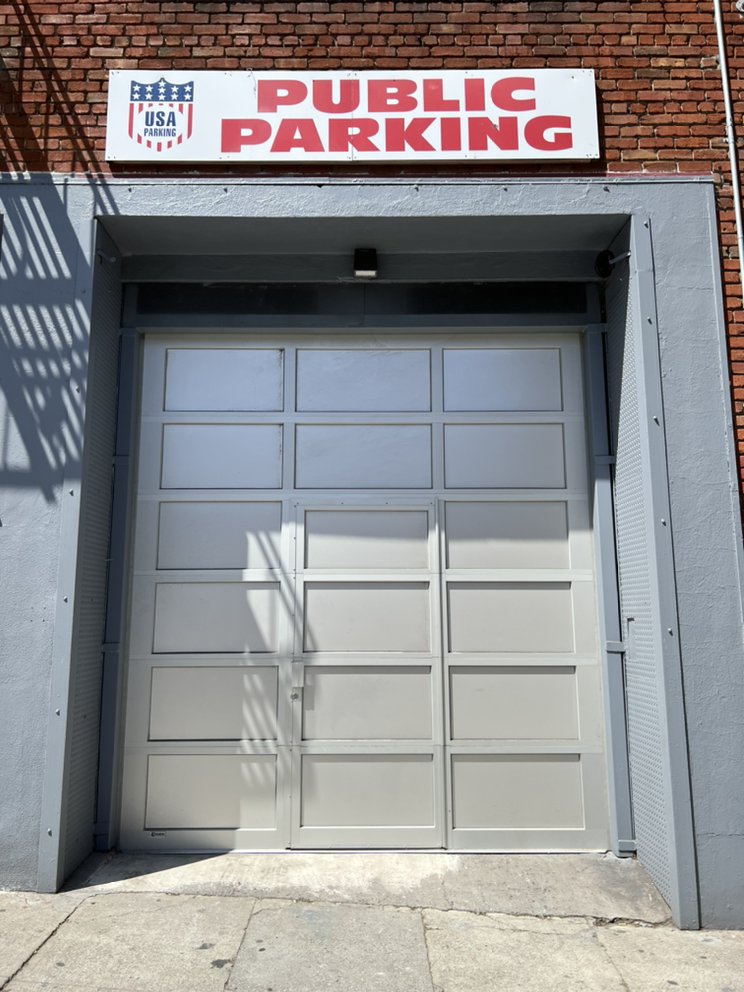 Commercial parking garage overhead door installed by Level 10